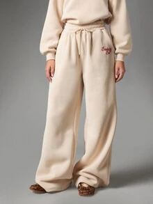 MISSGUIDED Six Christmas Snowflake Script Logo Wide Leg Sweatpants With Drawstring Waist Side Pockets And Bum Print - Apricot - View 3