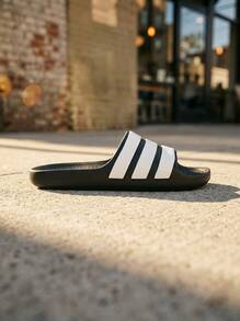 Adidas أديلت نسائي صندل منزلق قابل للتنفس ومقاوم للماء وقابل للتعديل للتسوق والشاطئ وعطلة نهاية الأسبوع باللون الأسود IF4134 - أبيض وأسود - مشاهدة 1