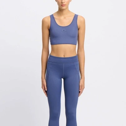  Reebok RIB MULTI-WAY Women's Bralette LK1 In Black Combines Soft, Skin-Friendly Comfort, Stretch Fit, Seamless Construction, Wire-Free Design, And Logo. Perfect For Training, Yoga, Layering, And Daily Wear.