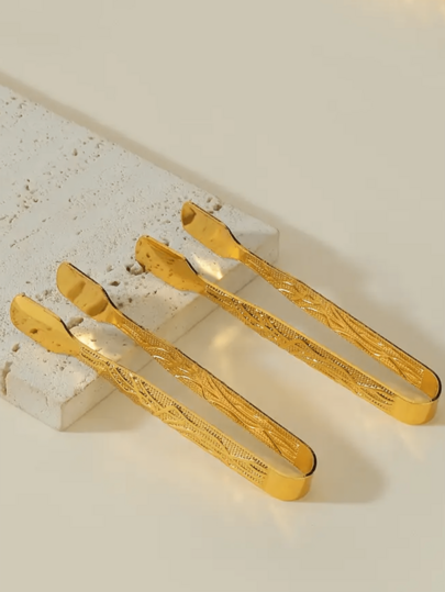 金色材质制成的香夹，与香炉一起使用作为小礼物，配有坚果和枣。