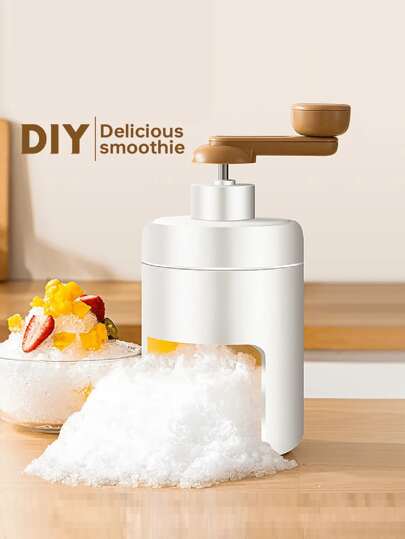 Un râpe à glace manuelle d'été, idéale pour faire des cônes de neige rafraîchissants, de la glace pilée et des glaces. Broyeur de glace manuel portable, livré avec un moule à glaçons, parfait pour les réunions à la maison et les desserts d'été