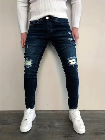 Jeans casuales distressed con bolsillo frontal y abotonados sencillos para uso diario