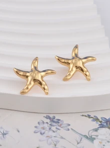 1 paire de boucles d'oreilles style rétro et simple en forme d'étoile de mer, dans un style de vacances européen et américain. Boucles d'oreilles en étoile polyvalentes et . Conviennent pour les femmes allant à la plage et s'assortissant