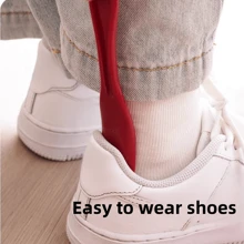 Nouveau chausse-pied compact et paresseux en plastique, permet de chausser les chaussures sans effort. Ne se plie pas et n'abîme pas les talons. Machine à chausser les chaussures facilement.
