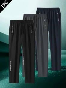 1条男士时尚户外运动裤，独特侧边印花装饰，实用拉链口袋，舒适弹力设计，支持动态运动。适合户外活动、旅行、健身、日常穿着、外出、居家和外出就餐。