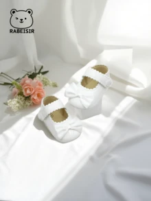 春秋時節的寶寶第一雙閃亮系帶行走鞋,時尚的簡約珍風格平底鞋,帶有蝴蝶結,適合室內和室外活動。