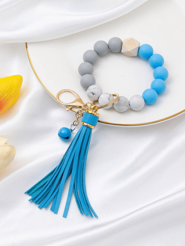 1 pieza Pulsera de cuentas DIY de silicona con borla de PU, llavero de pulsera de silicona, accesorio colgante para mochila, regalo de cumpleaños para niños y niñas