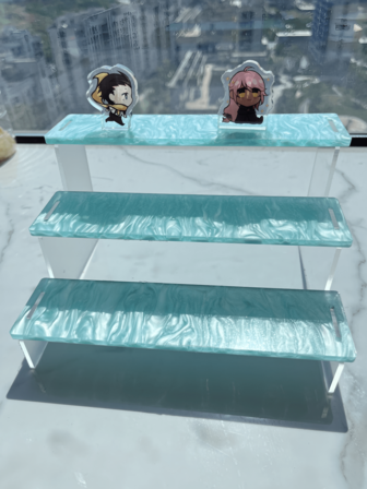 1 pieza Estante escalonado acrílico con colores, Estantería de 3 niveles para coleccionables, figuras, juguetes, colecciones, cómics, esmalte de uñas, almacenamiento de perfumes, cupcakes, decoraciones y artículos de almacenamiento