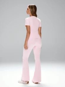 FWH "Daily-Wear Two Pieces Set For Women: Base-Style, Versatile And Conservative Design Suitable For Outdoor Commuting, Office, Fitness & Yoga. Features Sweet And Elegant Gentle Style, Slim-Fitting With Waist-Contracting Elastic Fabric. Round Neck, Short Sleeve Top Paired With High-Waist, Tummy-Control Micro-Flare Sports Pants For Leg-Lengthening Effect." - Pink - View 2