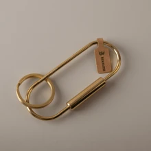 BLKSMTH BLKSMTH BRASS PENDANT IN THE SHAPE OF A PAPER CLIP