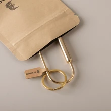 BLKSMTH BLKSMTH BRASS PENDANT IN THE SHAPE OF A PAPER CLIP