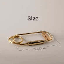BLKSMTH BLKSMTH BRASS PENDANT IN THE SHAPE OF A PAPER CLIP