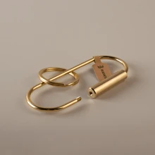 BLKSMTH BLKSMTH BRASS PENDANT IN THE SHAPE OF A PAPER CLIP