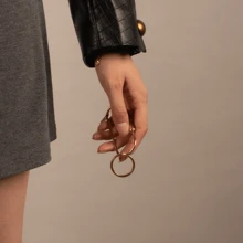 BLKSMTH BLKSMTH BRASS PENDANT IN THE SHAPE OF A PAPER CLIP