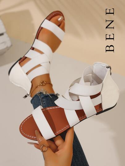 Stijlvolle dames sandalen met gekruiste banden, open teen, platte rits en hak.