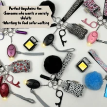 All Glam Multi Moo 9 Piece UK Legal Keychain Set With Panic Alarm, Torch, Whistle, Pom Pom, Wristlet, Pill Box, Sanitiser Pouch, And 3 In 1 Keychain Light - Strawberry Dream - View 1