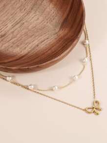 2 件不锈钢蝴蝶结吊坠项链套装，时尚简约蝴蝶结和 O 形珍珠链分层颈链，适合女性（珍珠数量随机）