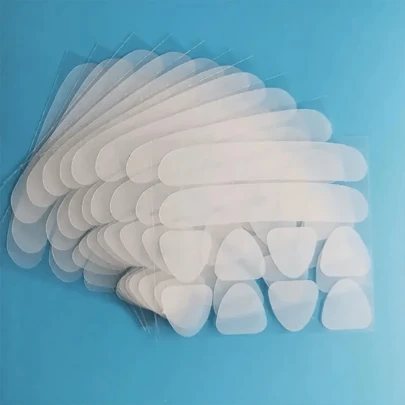 100 pezzi di nastri riutilizzabili in silicone per il sollevamento del viso - Patch adesive trasparenti per il supporto del viso
