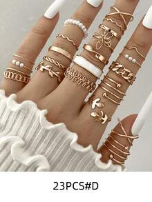 23入組時尚戒指套裝，新款金色和銀色樣式包含葉子、月亮、眼睛、蛇設計、滴油、鑽石、開口戒指套裝適合青少年女孩，禮物