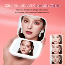 Espejo de maquillaje LED mini, equipado con un espejo plano de alta definición, tres ajustes de brillo, presión prolongada para ajuste de brillo infinito, 2x de aumento, puerto de carga USB desmontable, diseño plegable y abatible, mini, ligero y fácil de transportar, para retoques fáciles.