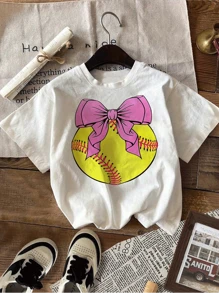 Girls Softball TShirt With Pink Bowknot Design Cute Summer Casual Short Sleeve Tops For Kids,Fun Softball Graphic Tee,Athletic Sports Theme Clothing,Soft And Comfortable Cotton Blend Fabric,Perfect Gift For Softball Players And Fans.