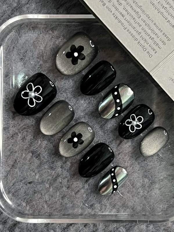 10 Pieces Of Black Cat Eye Short Oval Press Style Nails, Decorated With Hand-Painted Flowers, Exuding A High-End And Dark Spicy Style. The Nail Suit Is Shiny And Glossy, With A Fully Detachable False Nail Set That Is Suitable For Office Workers, Students, Party Girls, And Nail Products Of All Seasons. It Comes With 1 Jelly Gel And 1 Nail File.