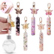 1 chai nước hoa cổ điển thanh lịch với mặt dây chuyền hình bướm 3D - Chai xịt có thể nạp lại, nắp vàng, họa tiết hoa mềm mại - Chai nước hoa, tinh dầu hoặc phụ kiện túi xách di động - Hộp đựng nước hoa cá nhân, chai nước hoa trang trí với cửa sổ hiển thị chất lỏng trong suốt - Nhiều màu - Xem 2