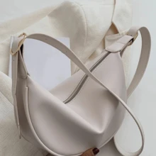 Bolsa a tiracolo de sela, casual e versátil, de design de nicho minimalista em cor sólida com zíper, de grande capacidade, ideal para transporte, modelo baguete