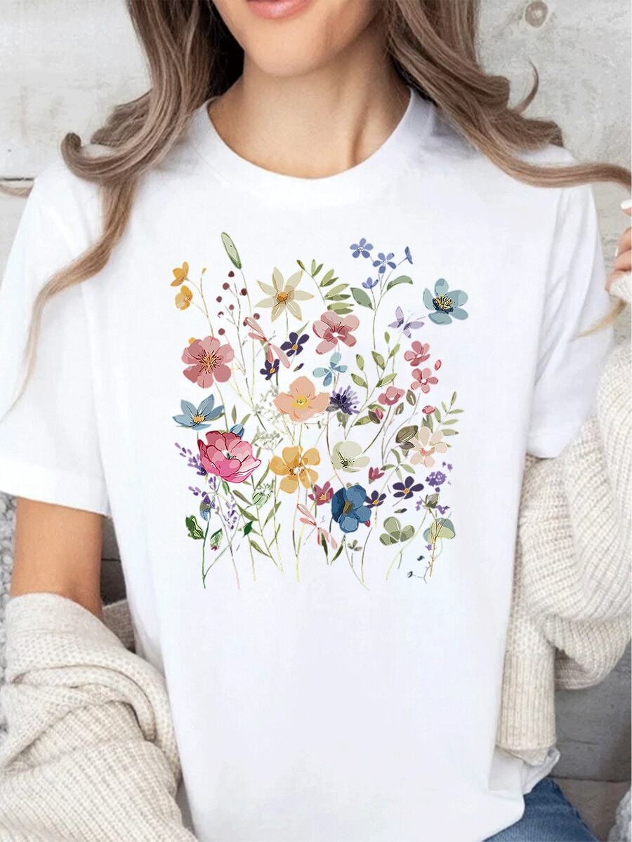 Elegante camiseta con estampado floral para mujer. Camiseta informal de manga corta y cuello redondo con un delicado estampado de flores silvestres. Confeccionada en tela suave y cómoda, perfecta para el día a día y para combinar con looks de moda. - Blanco - Ver 1