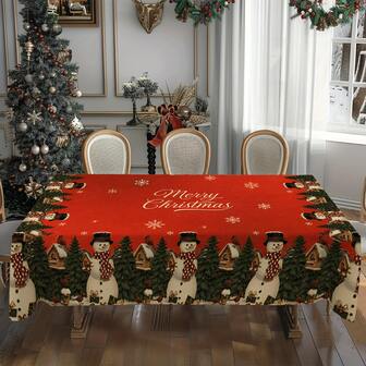 1块红色底布搭配精致圣诞元素，瞬间将餐桌变成节日拍照点，每一餐都充满圣诞气氛~圣诞红底雪人&圣诞树图案桌布，耐污耐用涤纶桌布，适合日常家庭聚会、客厅、餐厅、圣诞主题活动