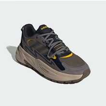 أديداس أحذية رياضية سميكة الوحدة للرجال والنساء، مريحة وخفيفة الوزن للاستخدام الخارجي، متينة وذات تصميم كلاسيكي من طراز OZWAVE 2.0 منخفضة الرقبة، تصميم بسيط وعملي يطيل الشكل، أحذية منصة مناسبة للتنقل، موصى بها للجنسين JR3188 - خياطة بنية اللون - مشاهدة 1