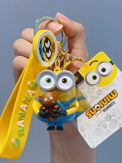 Llavero con abrazo de Bob de los Minions, edición marrón, pose de abrazo de oso, adorable coleccionable, decoración para bolsos y llaves, para exhibir en casa, regalo para fanáticos de la animación, dibujo animado raro, cadena de aleación, toque kawaii, clip para mochila, listo para regalar, edición limitada, estética marrón, para amantes de Bob de los Minions, un regalo adorable, compañero de escritorio.