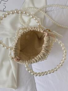 حقيبة يد صغيرة نسائية مصنوعة من خرز الزجاج المنسوج بتصميم مفرغ