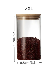 高硼硅玻璃密封储物罐，适用于存放谷物、麦片、干果、柑橘皮和茶叶。直筒圆柱形设计，配竹制盖子，简约透明，是家居收纳的理想之选。