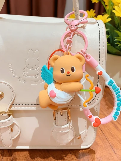 Butterbear rosa ängel nyckelringsberlock, bedårande hänge, änglavingar, hjärtdetalj, väsk- och nyckeldekor, dagliga resor, present till djurälskare, kawaii-berlock, ryggsäcksaccessoar, legeringskedja, begränsad upplaga, presentklar, änglalik vibe, söt accessoar, skrivbordskompis, innerlig pop, snygg älskare, samlarobjekt, rosa finish