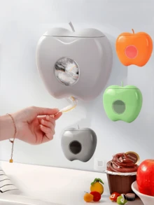 موزع شخصي مثبت على الحائط بشكل تفاحة مصنوع من البلاستيك مع تخزين خالي من العطور لفيلم التغليف وأغطية الاستحمام - حاوية منظم متعددة الاستخدامات للمنزل والحمام