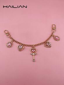 HAILIAN 以美丽少女的魔法棒和水滴宝石为主题设计的合金包包延长链及包包肩带。搭配镶嵌珍珠钻石的魔法棒，象征着智慧与善良，以及交织枝条支撑的心形和闪亮的水滴。可用作包包挂件、延长链、包包肩带，当然也可以作为送给家人、朋友、爱人的小礼物。 - 彩色 - 查看 11