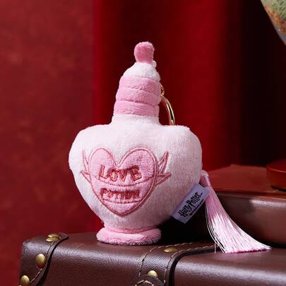 Serie Harry Potter de MINISO - Colgante de pareja de poción de amor, llavero de peluche en forma de corazón, decoración de bolso, ornamento colgante de peluche rosa
