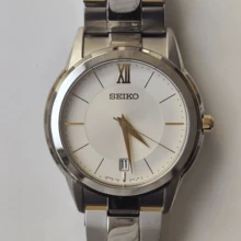 Seiko Reloj de cuarzo para hombre, correa de acero plateado y dorado, esfera blanca, adecuado para uso diario de negocios SGEF45J1