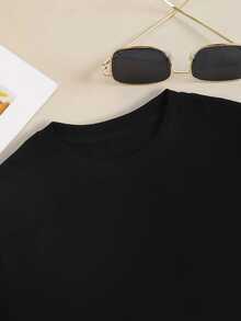 Una camiseta de mujer de estilo casual, de corte holgado, con cuello redondo y estampado floral de manga corta - Negro 2 - Ver 3