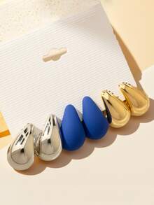 Conjunto de tres pares de oro, plata y azul.