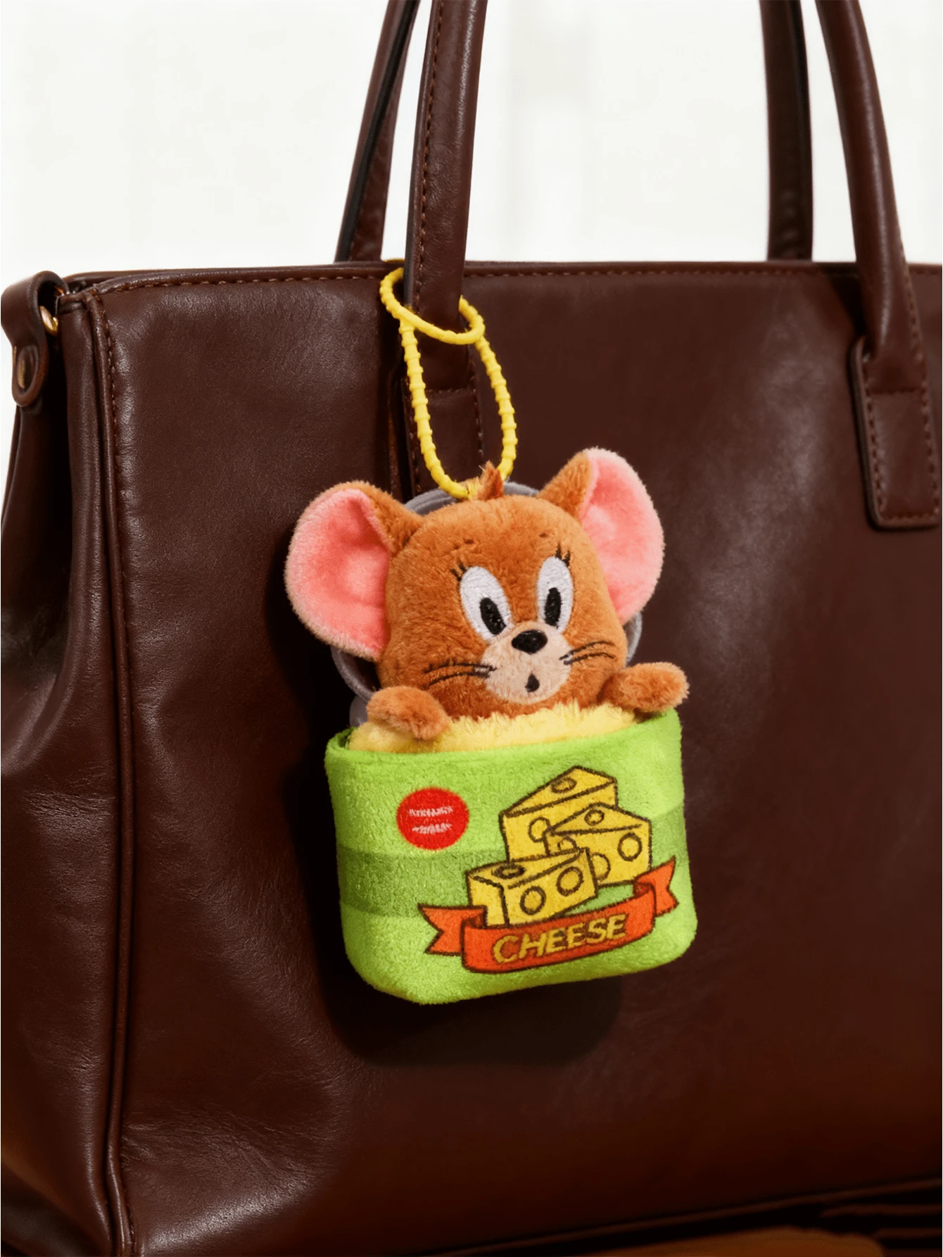Classic Tom & Jerry Jerry Cheese Can Plush Keychain - Soft Green Fabric with Yellow Cheese Prints & "CHEESE" Text, Brown Furry Mouse (Pink Ears, Curious Expression) Emerging from Can, Yellow Elastic Strap, 20cm Height, Paired with Tom's Catpack Can, eal for Strap, 20cm Height, Paired with Tom's Catpack Can, eal for Strap, M