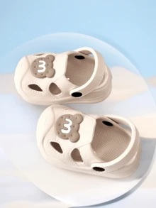 Letnie, nowe sandały dla maluchów w stylu kreskówkowym z 2025 roku, antypoślizgowe, wytrzymałe kapcie domowe, oddychające buty dla niemowląt, materiał EVA z zamkniętymi palcami, lekkie i wygodne buty ogrodowe dla niemowląt - Beżowy - Zobacz 6