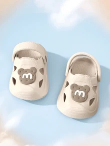 Letnie, nowe sandały dla maluchów w stylu kreskówkowym z 2025 roku, antypoślizgowe, wytrzymałe kapcie domowe, oddychające buty dla niemowląt, materiał EVA z zamkniętymi palcami, lekkie i wygodne buty ogrodowe dla niemowląt - Beżowy - Zobacz 7