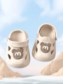 Letnie, nowe sandały dla maluchów w stylu kreskówkowym z 2025 roku, antypoślizgowe, wytrzymałe kapcie domowe, oddychające buty dla niemowląt, materiał EVA z zamkniętymi palcami, lekkie i wygodne buty ogrodowe dla niemowląt - Beżowy - Zobacz 2