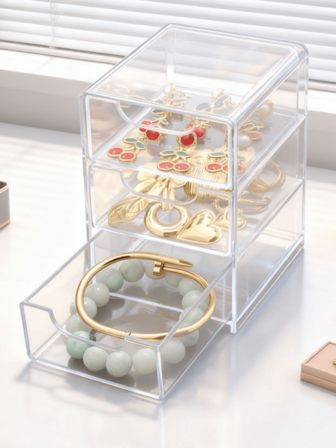 三层抽屉式桌面收纳盒，可存放耳环、项链、手镯和戒指。透明七层阶梯式化妆品展示架，可存放指甲油、太阳镜、精油、眼镜、口红等，是送给女性的礼物，也是圣诞礼物和女性送礼佳品。