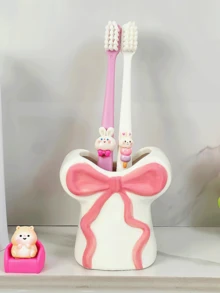 Hộp đựng bàn chải đánh răng bằng nhựa resin đáng yêu và được thiết kế sáng tạo này, với điểm nhấn là chiếc nơ ruy băng, có thể dùng để đựng bàn chải đánh răng, kem đánh răng và cọ trang điểm. Đây là một phụ kiện gia đình và phòng tắm vô cùng thiết thực, đồng thời cũng là một lựa chọn tuyệt vời cho quà tặng dịp lễ. - Nhiều màu - Xem 6