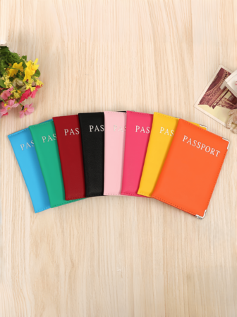 A Minimalist Passport Holder With Metal Trim, A Travel Passport Cover, A Travel Essential, A Back-To-School Item, A Vacation Essential, A Vacation Accessory, And A Passport Cover.