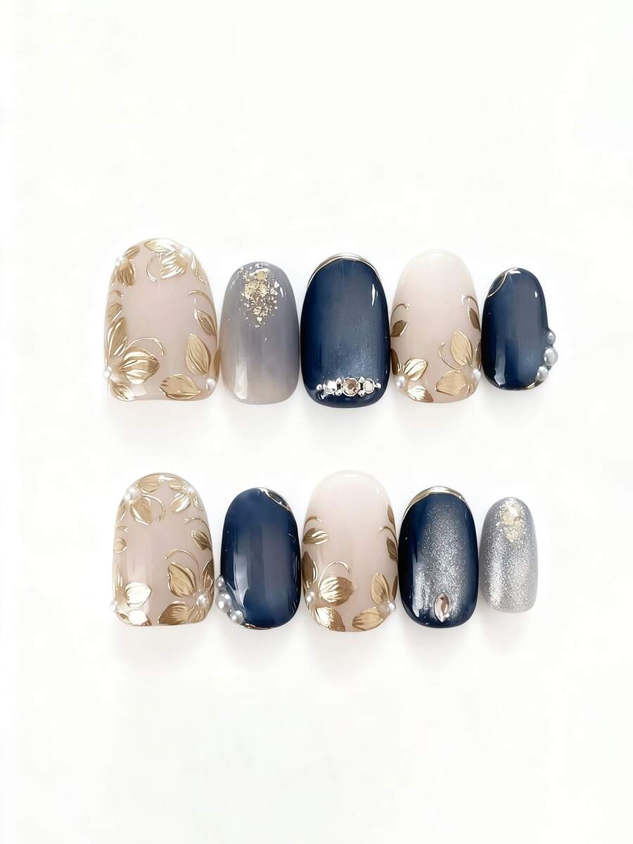 10片纯手工制作的中长椭圆形美甲贴片，蓝白金猫眼图案，饰以金属花朵，精致柔和，光泽优雅，适合女性和女孩，春夏秋冬皆宜，节日及日常使用。 - 霧霾藍 - 查看 1