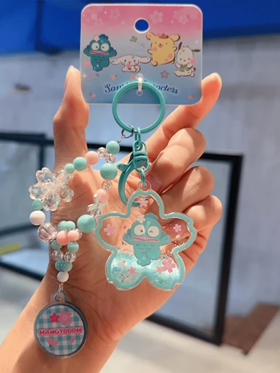 Sanrio Hangyodon Sakura Oil-Filled Keychain, Official Licensed Kawaii Cherry Blossom Pendant, Glitter Shimmer Oil-Filled Design + Exquisite Beaded Detail, Soft Pastel Sakura Aesthetic, Premium Durable Material, Key Ring For Bags/Keys/Backpacks, Cute Anime Charm For Girls/Teens/Sanrio Enthusiasts, Sweet Gift For Hangyodon Collectors/Birthday/Holiday